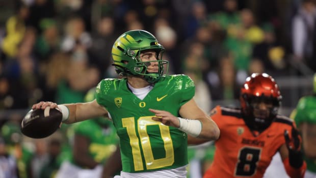 Oregon quarterback Bo Nix throws downfield against Oregon State during the second quarter at Autzen Stadium on Friday, Nov. 24, 2023, in Eugene.